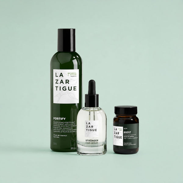 Lazartigue – Routine Anti-Chute Réactionnelle, trois flacons de produits de soin pour les cheveux, sur fond uni