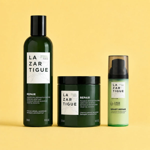 Lazartigue – Trio Repair (Shampoing + Masque + Concentré Restructurant), trois flacons de produits de beauté verts sur fond jaune